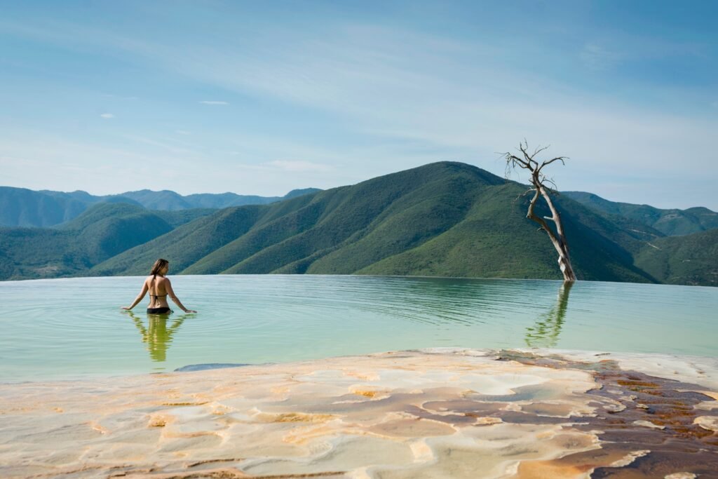 Woman relaxing in thermal spring Hierve el Agua Oaxaca Mexico