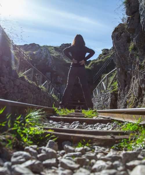 A young woman in the abandoned mines of Covadonga