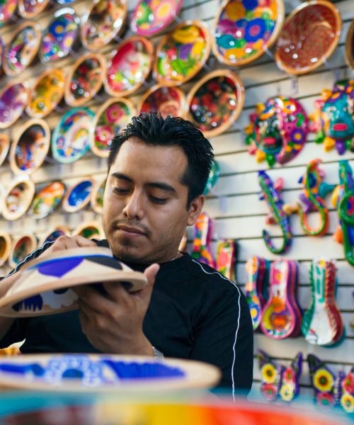 mexican artist portraid with the potterry that he paint